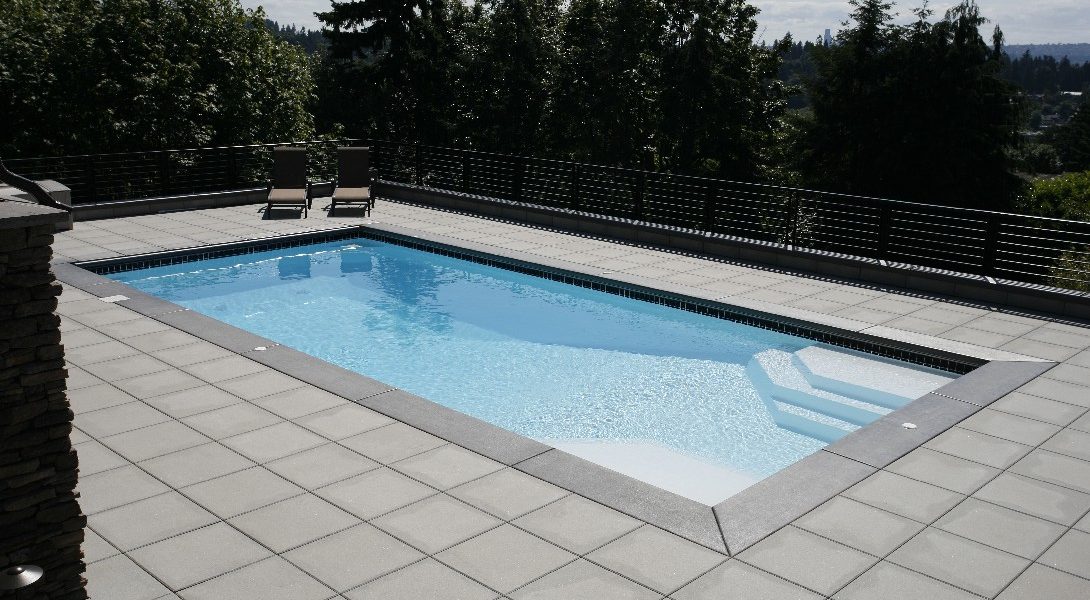 The Niagara is a rectangular fiberglass swimming pool, very similar to the Luxor Deep End pool. We've slightly altered this shape so that it provides a modest 33' length paired with a 7' 9" deep end. It's perfect for medium to large sized backyards and works excellent for regular aerobic activity.
