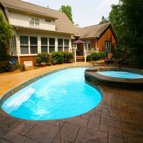 The Seaside is a beautiful fiberglass pool designed for small to medium sized backyards.