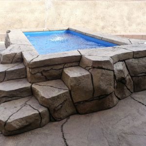 The Canyon Lake is a very unique fiberglass pool. In fact, the primary differentiator is its elevated design. Constructed to sit above ground, you're free to construct any array of natural materials around the outside. This is a great accent piece for any backyard and showcase pool for impress friends and family.
