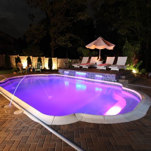 The Vegas is a stunning display of how beautiful a fiberglass pool from San Juan Pools can be! As the sun goes down, the night life is just beginning! Bring a little bit of Vegas back home with this elegant and beautiful Grecian pool shape!