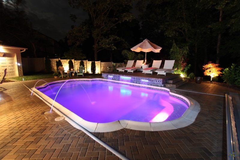 The Vegas is a stunning display of how beautiful a fiberglass pool from San Juan Pools can be! As the sun goes down, the night life is just beginning! Bring a little bit of Vegas back home with this elegant and beautiful Grecian pool shape!