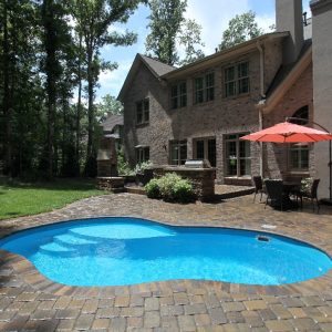 The Crystal Cove is a free form & compact fiberglass swimming pool. Able to fit in nearly any size backyard, this pool measures only 3,300 gallons. Including a tanning ledge and 5' deep end, it's petite but backs a lot of value into its free form frame!