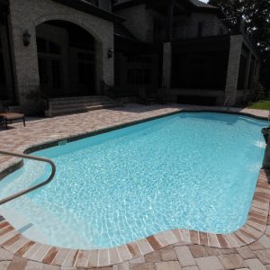 The Phoenix is a fiberglass swimming pool with a modern touch. Designed as a Grecian layout, the Phoenix resembles a rectangular shape with bell-end curves on each end. In addition, we've utilized a Sport Bottom Hopper which means the deep end is right in the middle of its body.