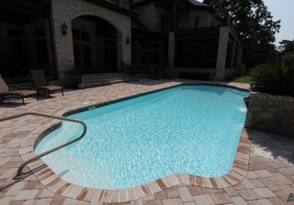 The Phoenix is a fiberglass swimming pool with a modern touch. Designed as a Grecian layout, the Phoenix resembles a rectangular shape with bell-end curves on each end. In addition, we've utilized a Sport Bottom Hopper which means the deep end is right in the middle of its body.