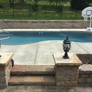 The Sandcastle is a serene free form swimming pool with a 5' 5" deep end. It provides ample bench seating for your swimmers and guest as well as a nice tanning ledge. This is a great swimming pool for those who want to casually swim and relax with friends and family.