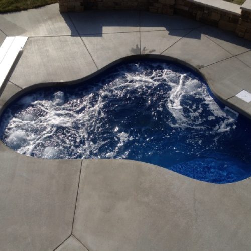 The Montreal Spa is a medium sized fiberglass spa that holds a maximum of 1,925 Gallons. This free form design has less bench seating than the Sydney or Vancouver - comfortably holding 2-4 bathers in its serene waters. This unique spa shape is perfect for a petite backyard or as an addition to any of our fiberglass pool shapes.