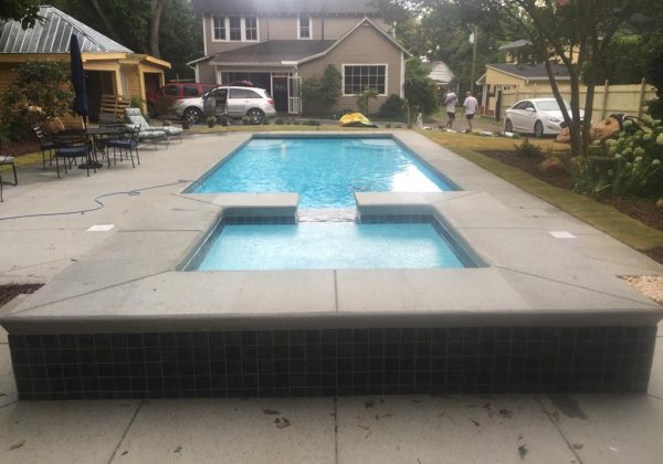 Here is another image of a Lido Spa installed with a spillover effect into the fiberglass below.