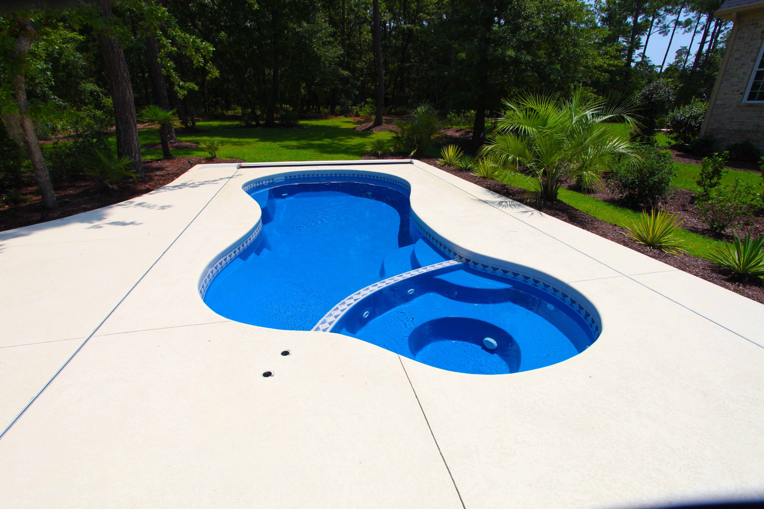 The Mandalay Bay is an exceptional free form fiberglass swimming pool.